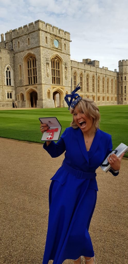 Mrs Carson receiving her MBE from Windsor Castle