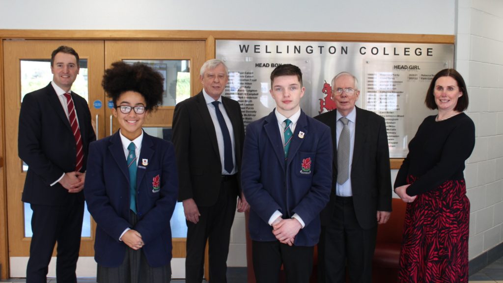Pictured (L-R) in the photo are Principal, David Castles; Head Girl, Faith Cotter; EA Chairperson, Barry Mulholland; Head Boy, Ryan McCarroll; Panel Chairperson, Dr. Keir Bloomer; and EA CEO, Sara Long