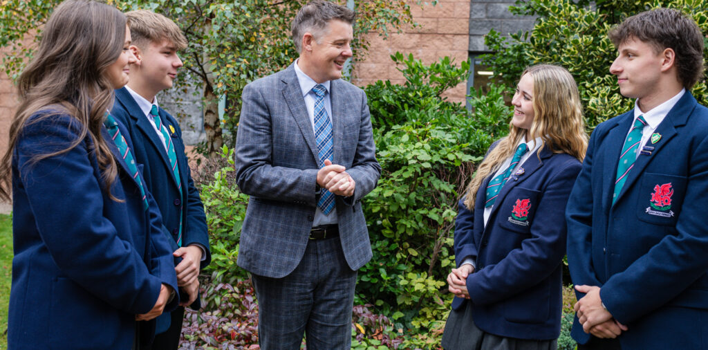 Banner showing senior prefects in courtyard